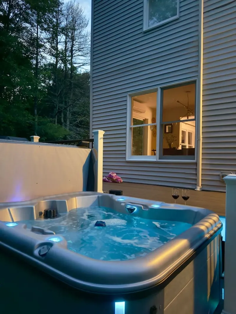 Private hot tub, lit and heated year-round