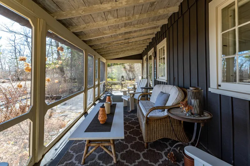 Screened-In Porch: Enjoy peaceful moments with fresh air and scenic views from this inviting retreat!