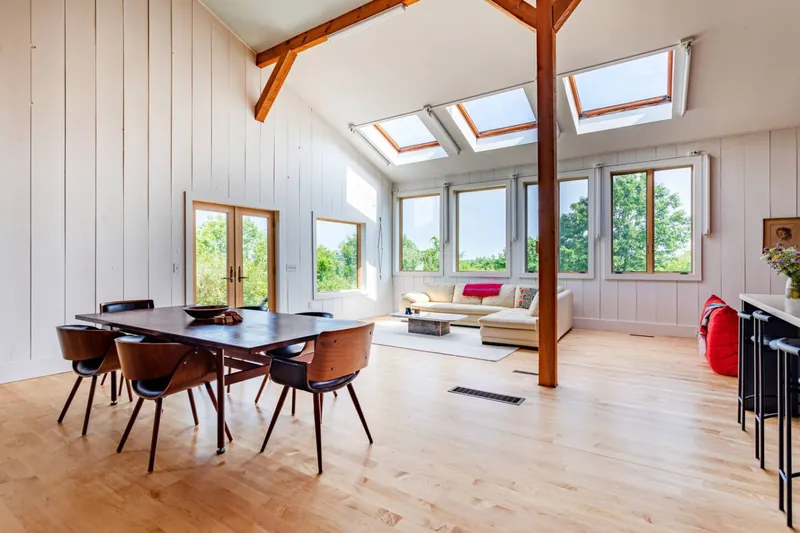 Dining Room: Sun-drenched space with sweeping views, perfect for relaxation or gatherings!