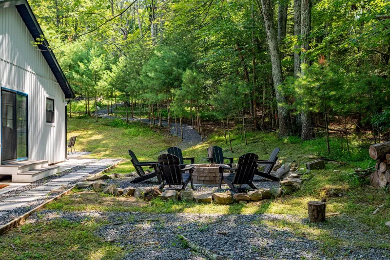 Outdoor Oasis: Gather around the fire pit and enjoy serene forest views in Saugerties!