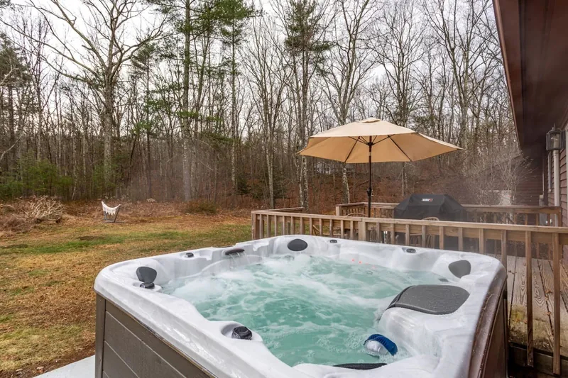 Unwind in the hot tub while enjoying serene woodland views!