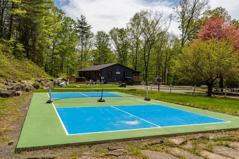 Serve up some fun on this bright outdoor court surrounded by nature!