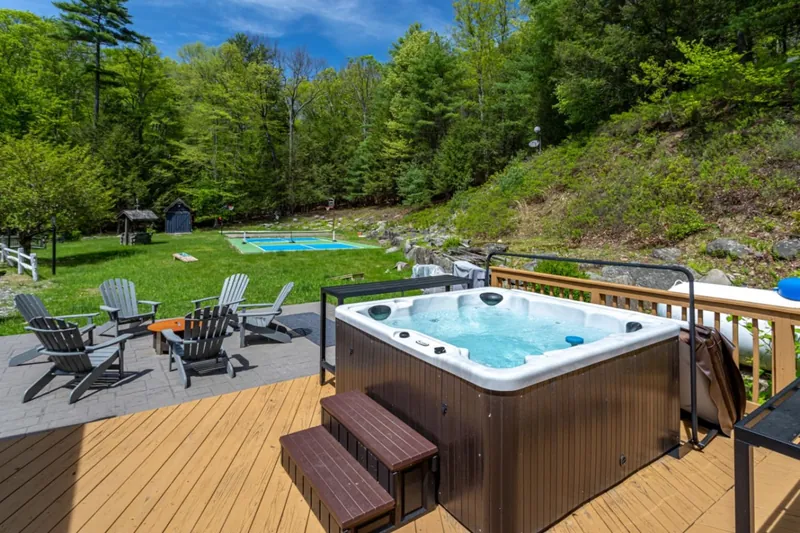 Relax in the hot tub and enjoy vibrant nature views from the spacious deck!