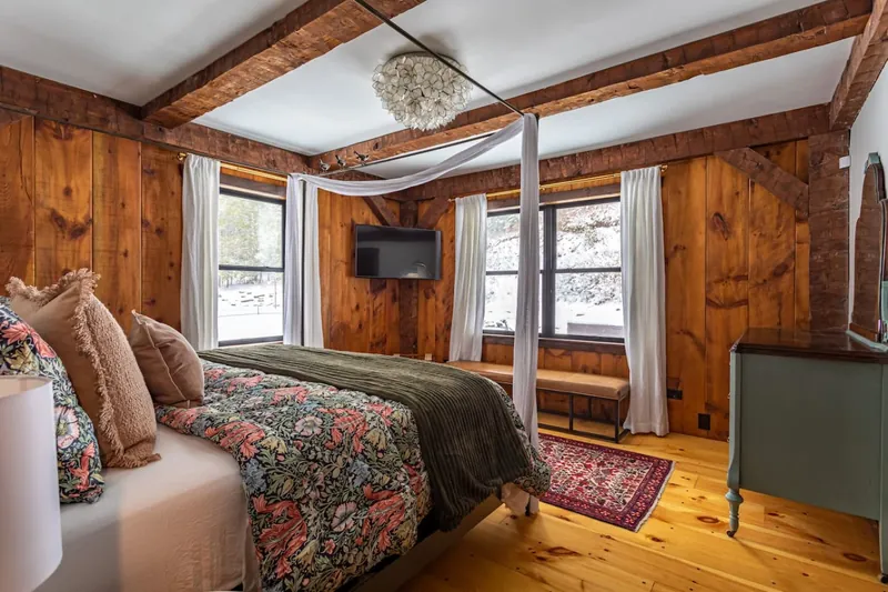 King bed with canopy, flat-screen TV