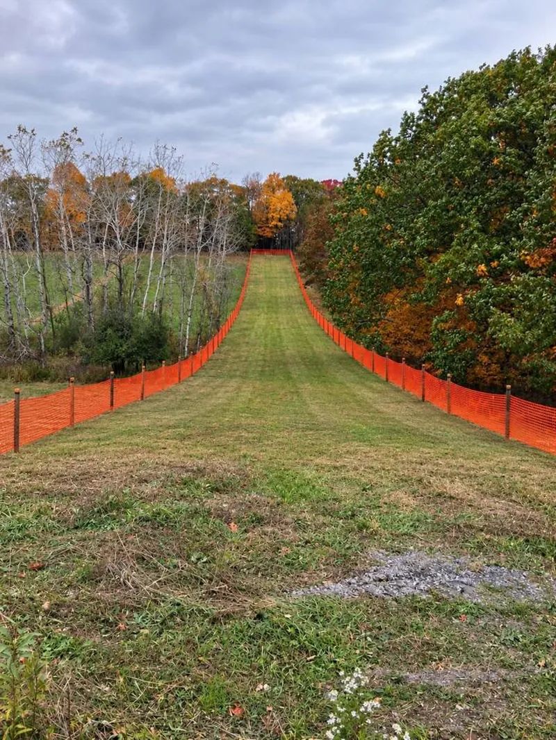 Private sledding hill (fall view). Sleds provided in winter, snow permitting.
