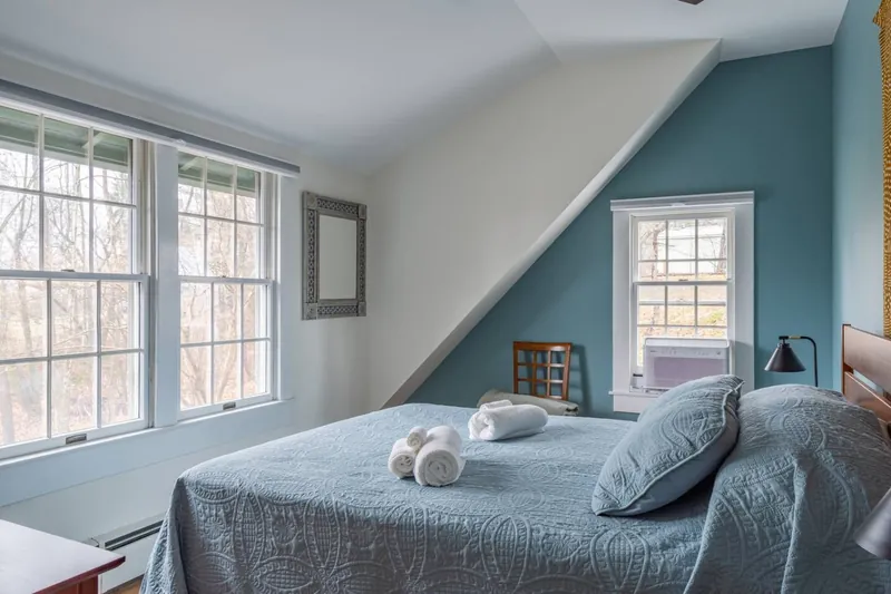 Charming Bedroom: Sunlit sanctuary with elegant decor and tranquil views, your retreat awaits