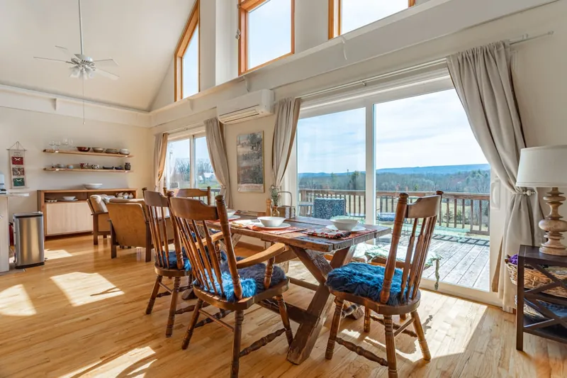 Let the sunshine fill out the space. Large windows and deck doors allow for plenty of natural light.