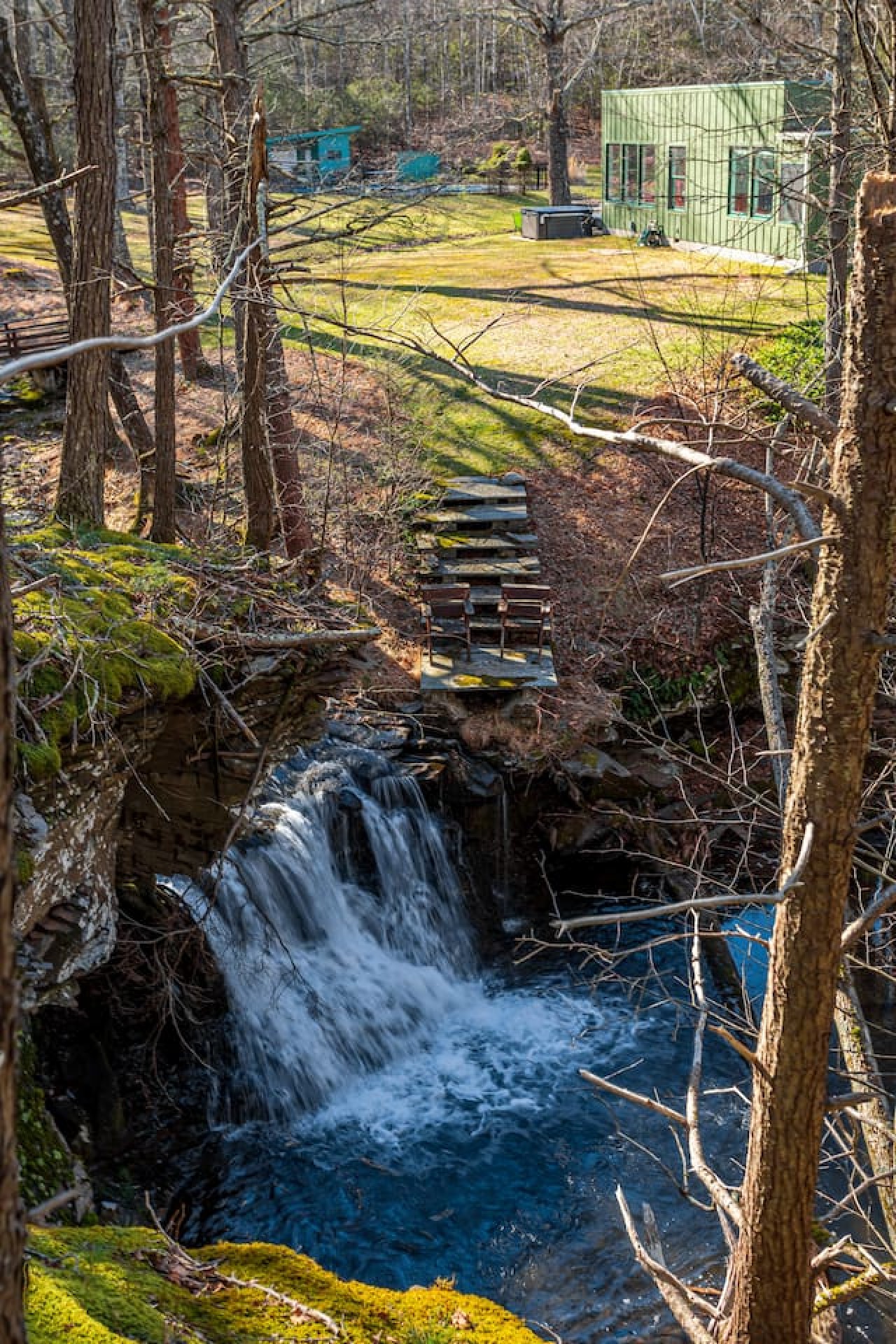 Waterfall cascading over rocks on the Waterfall House property